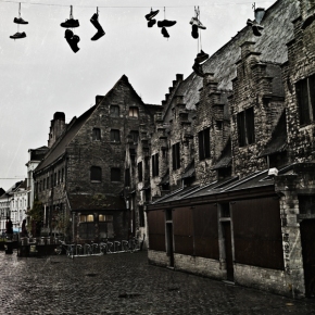 Hanging Shoes Above Urban Streets